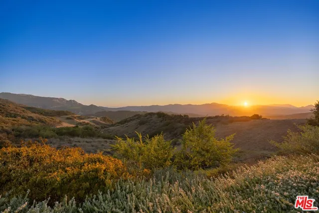 a view of swimming pool with a table and chairs