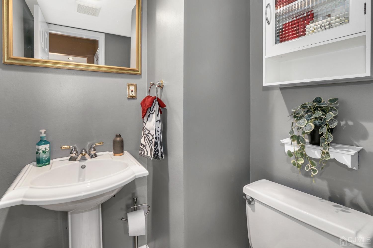 165 Howell Avenue Fords, NJ 08863 - Photo 14 of 31 a bathroom with a sink and a toilet