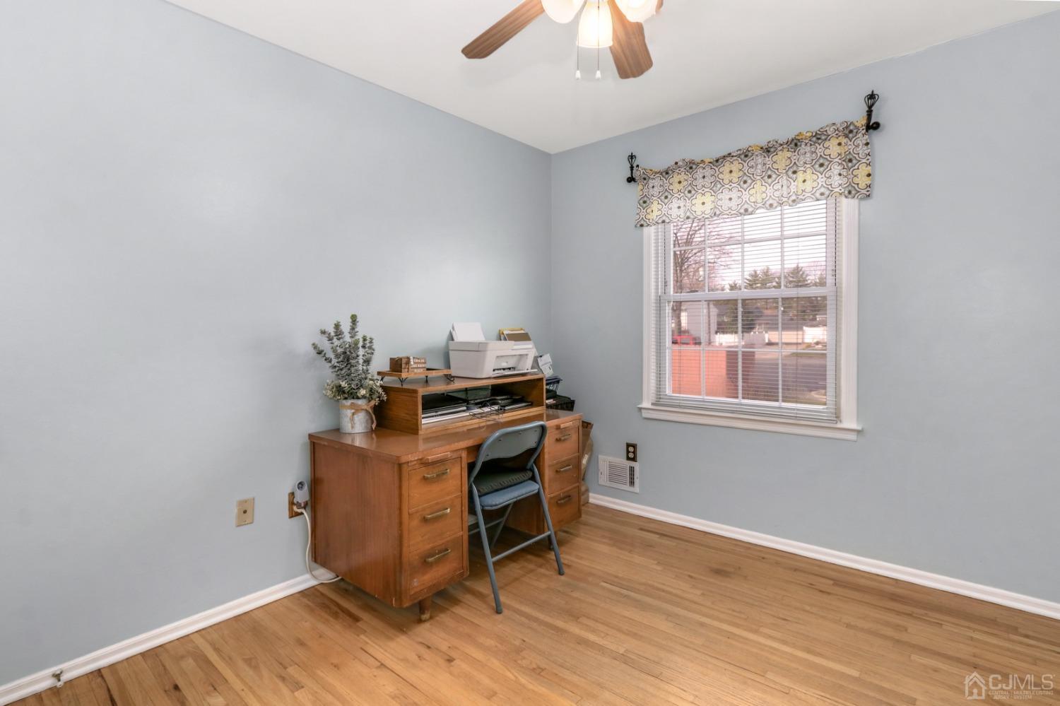 165 Howell Avenue Fords, NJ 08863 - Photo 20 of 31 a view of workspace with wooden floor and windows
