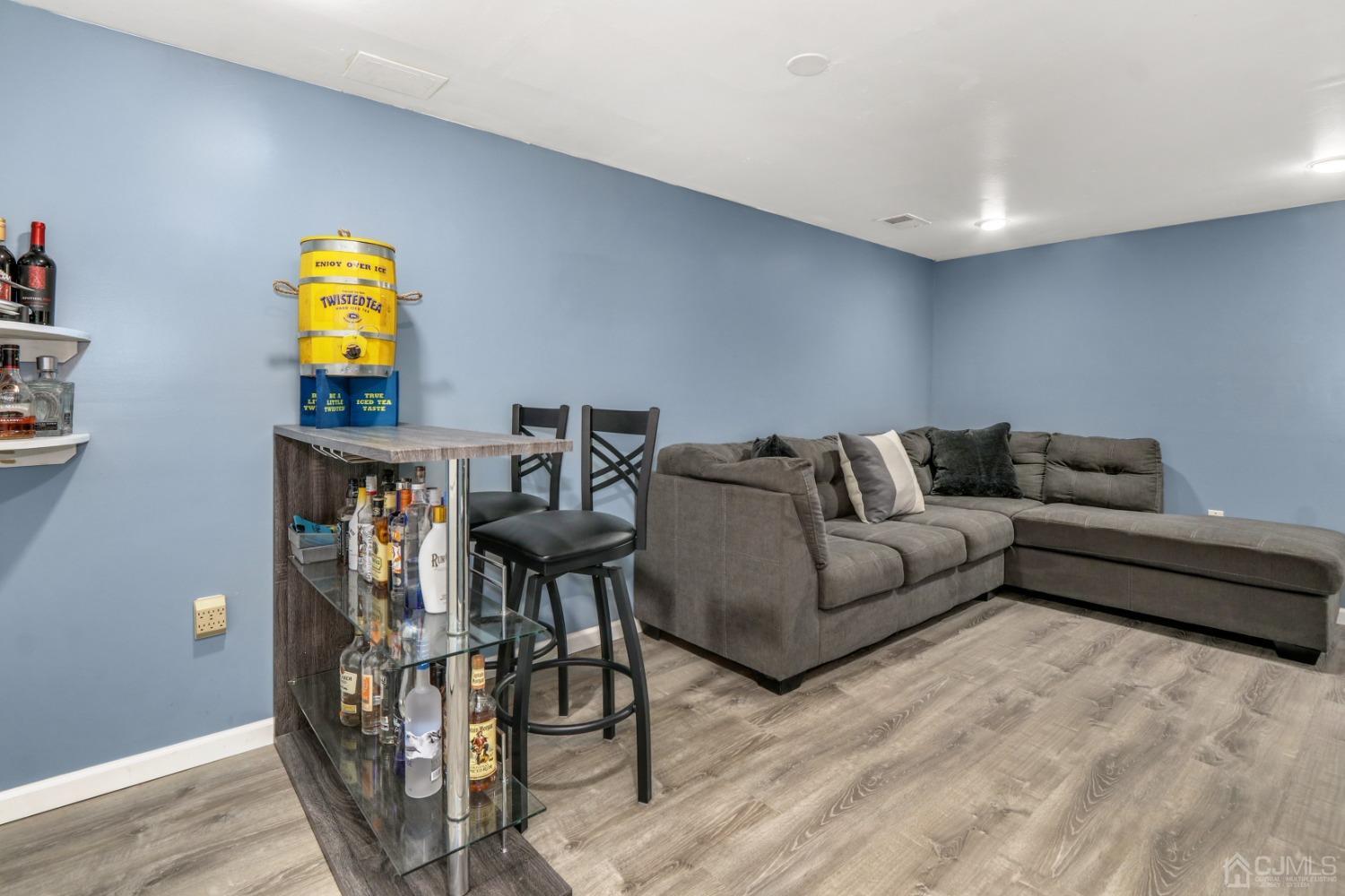 165 Howell Avenue Fords, NJ 08863 - Photo 22 of 31 a living room with furniture and wooden floor