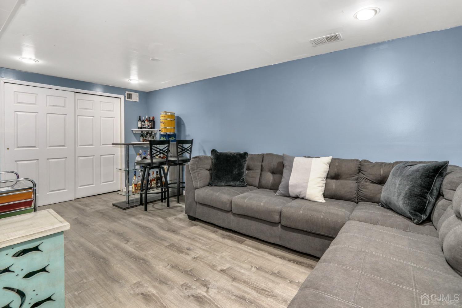 165 Howell Avenue Fords, NJ 08863 - Photo 23 of 31 a living room with furniture and a wooden floor