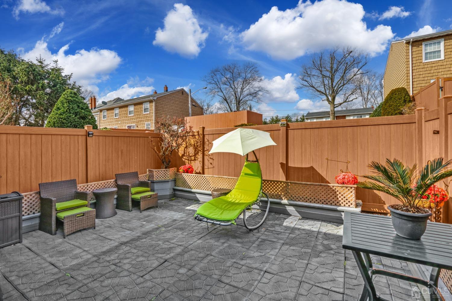 165 Howell Avenue Fords, NJ 08863 - Photo 25 of 31 a view of a backyard with couches and a fire pit