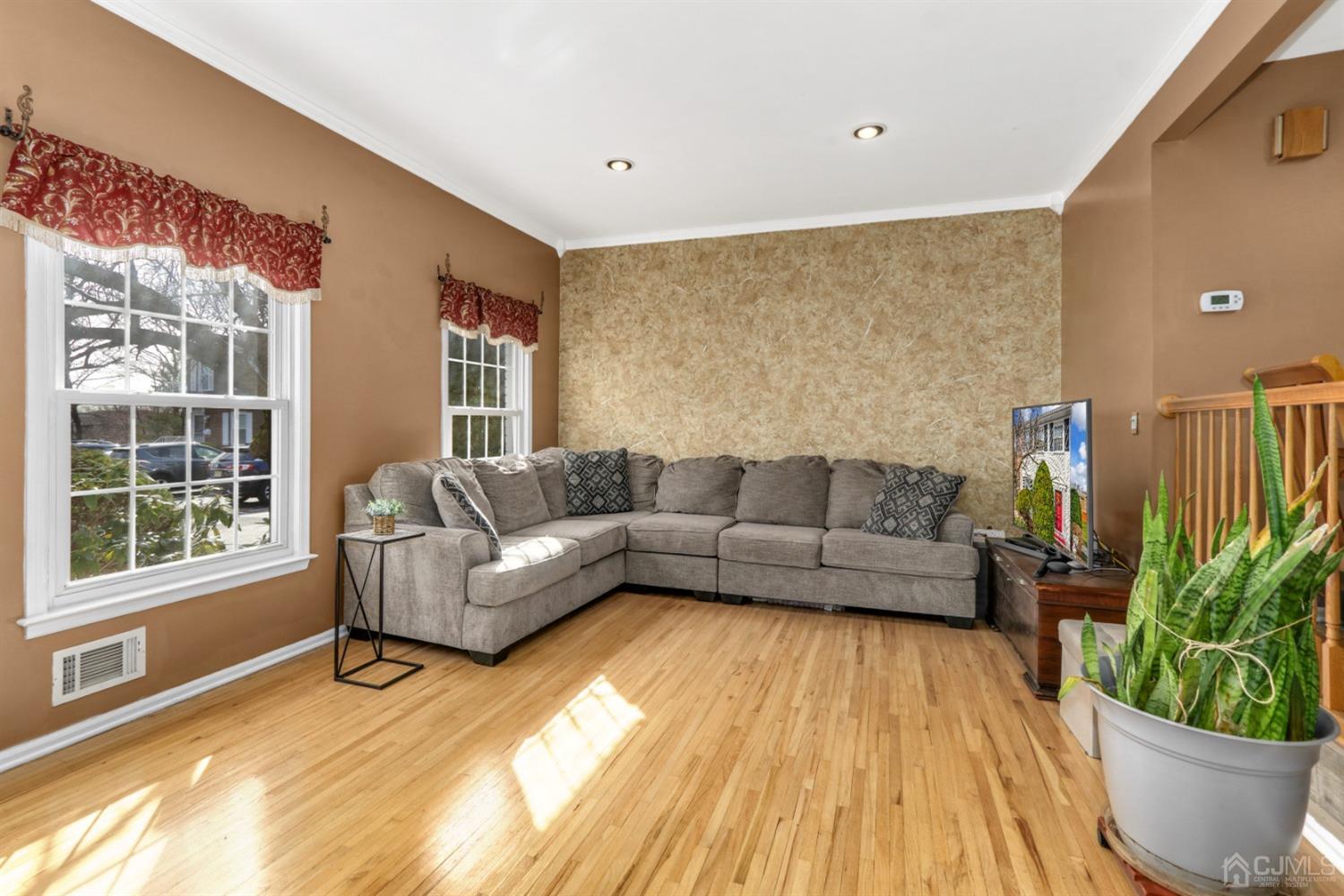 165 Howell Avenue Fords, NJ 08863 - Photo 3 of 31 a living room with furniture and a potted plant