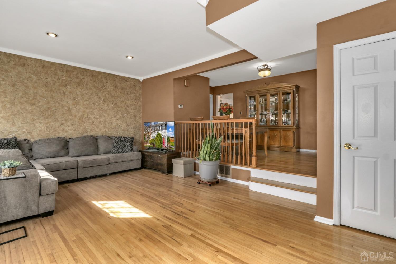 165 Howell Avenue Fords, NJ 08863 - Photo 4 of 31 a living room with furniture and a wooden floor
