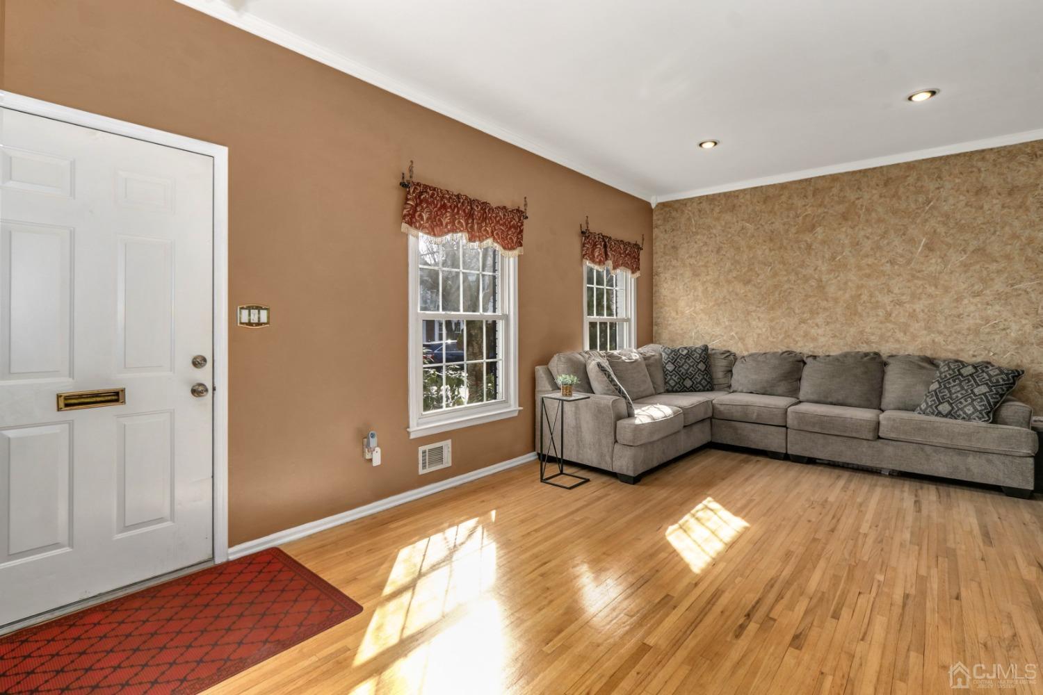 165 Howell Avenue Fords, NJ 08863 - Photo 5 of 31 a living room with furniture and a floor to ceiling window