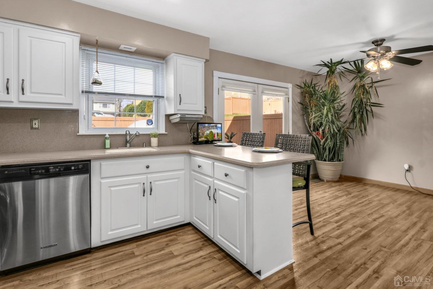 165 Howell Avenue Fords, NJ 08863 - Photo 9 of 31 a kitchen with a white counter top space a sink and appliances