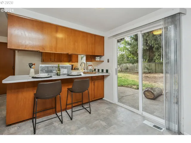 a kitchen with a sink and a window