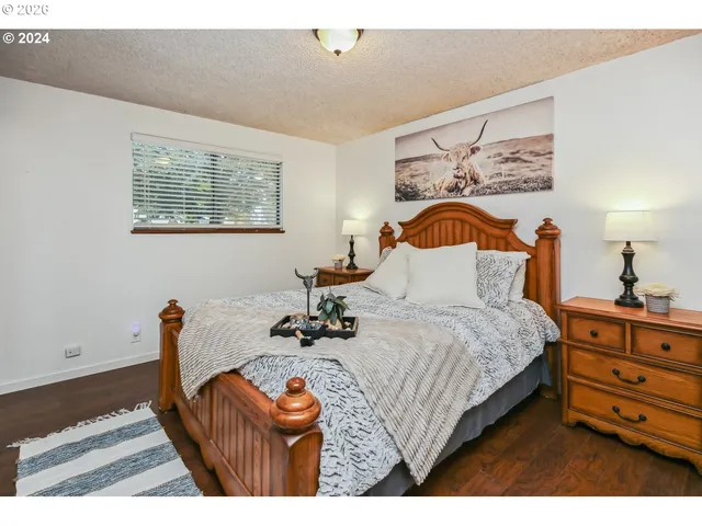 a bedroom with bed and window