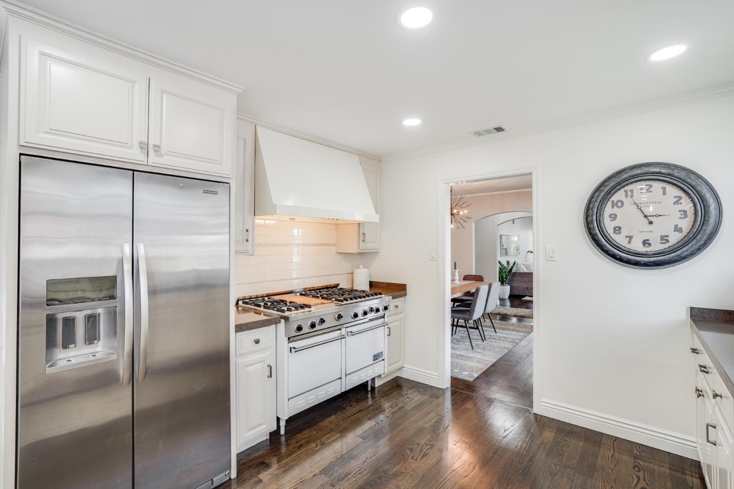 100 Chestnut Street San Carlos, CA 94070 - Photo 13 of 45 a kitchen with a refrigerator a stove and a wooden floor
