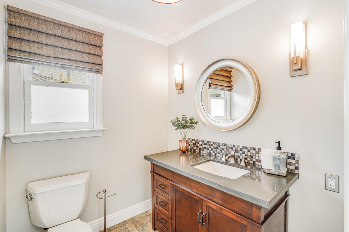 100 Chestnut Street San Carlos, CA 94070 - Photo 21 of 45 a bathroom with a toilet a sink and a mirror
