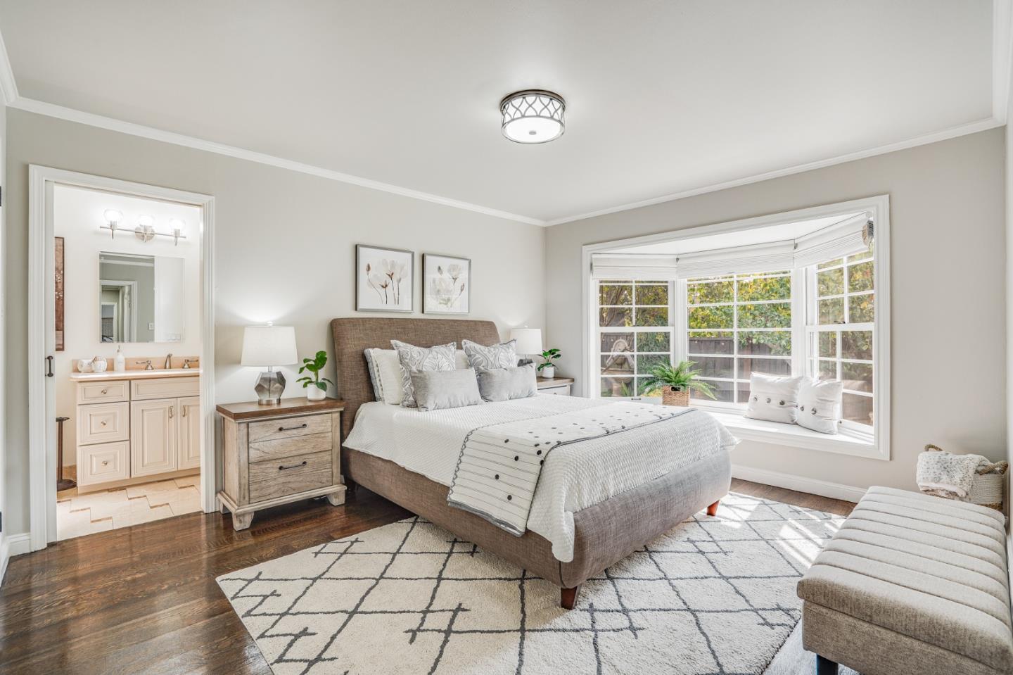 100 Chestnut Street San Carlos, CA 94070 - Photo 28 of 45 a spacious bedroom with a large bed and a window