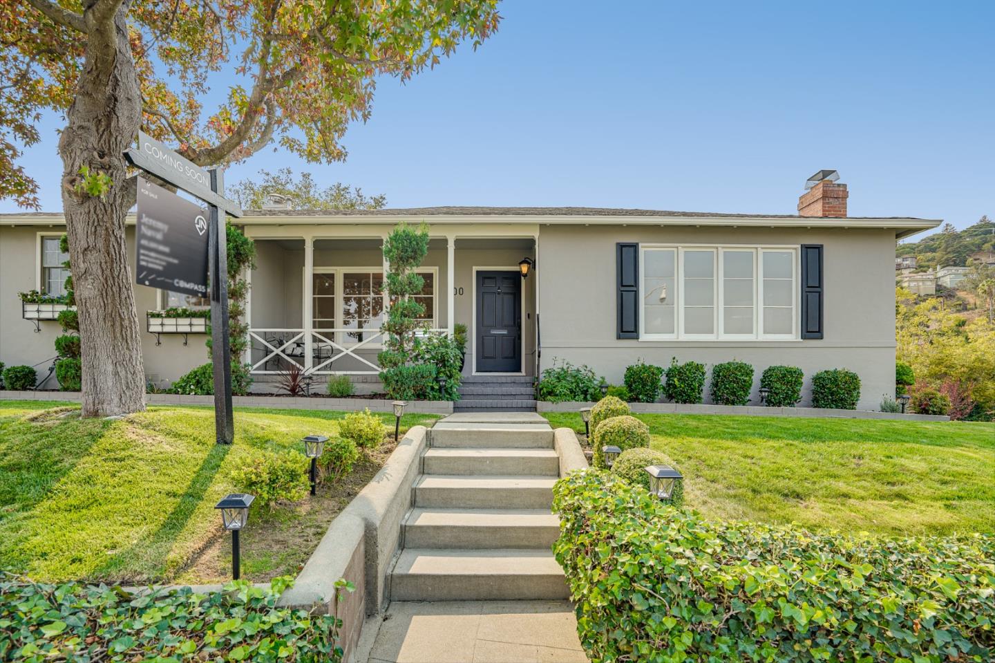 100 Chestnut Street San Carlos, CA 94070 - Photo 3 of 45 a front view of a house with a yard and potted plants