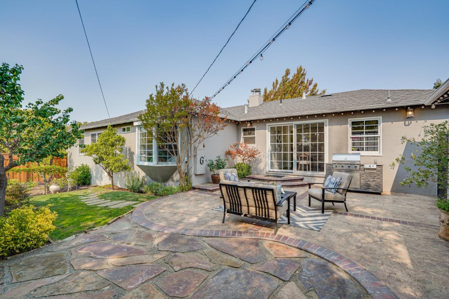 100 Chestnut Street San Carlos, CA 94070 - Photo 33 of 45 a view of a house with patio in the backyard