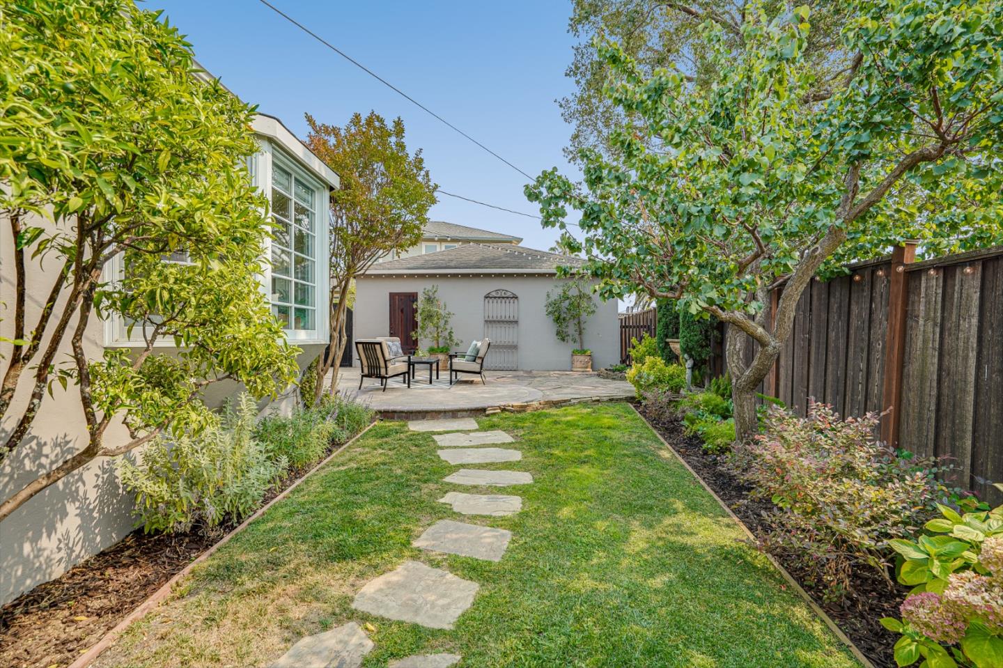 100 Chestnut Street San Carlos, CA 94070 - Photo 36 of 45 a view of a chair and table in backyard of the house