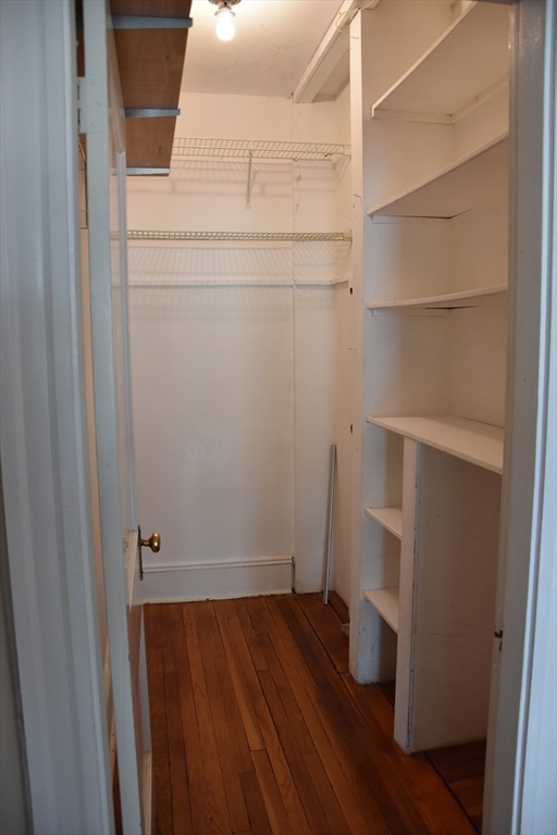 134 Fuller Street, Unit 3 Brookline, MA 02446 - Photo 7 of 8 a view of walk in closet with empty racks