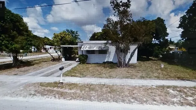 a room that has a dresser and a window