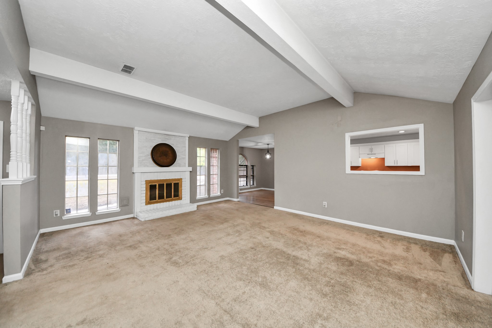 411 Dover Lane Spring, TX 77373 - Photo 13 of 40 an empty room with a fireplace and window