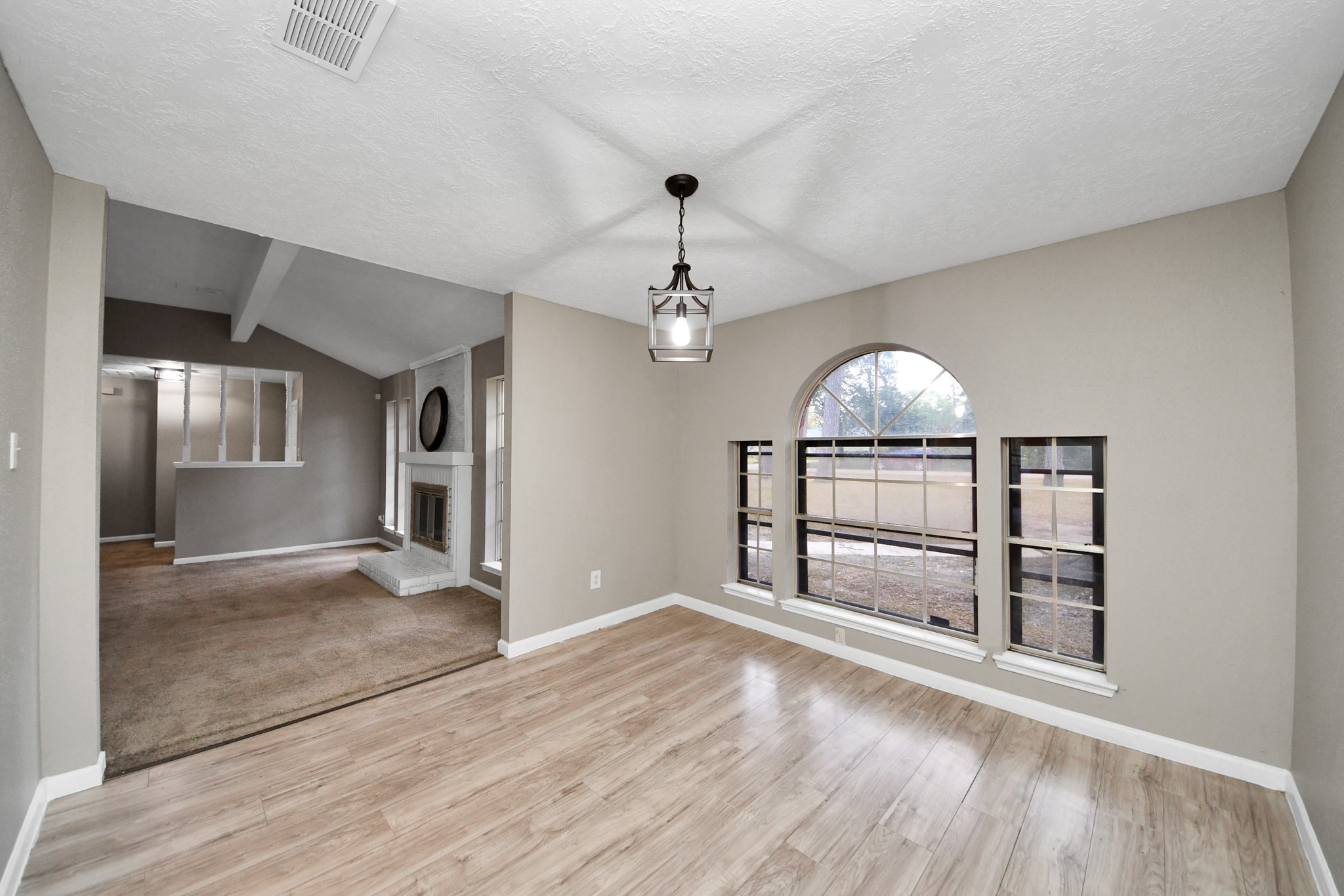 411 Dover Lane Spring, TX 77373 - Photo 21 of 40 wooden floor in an empty room with a window