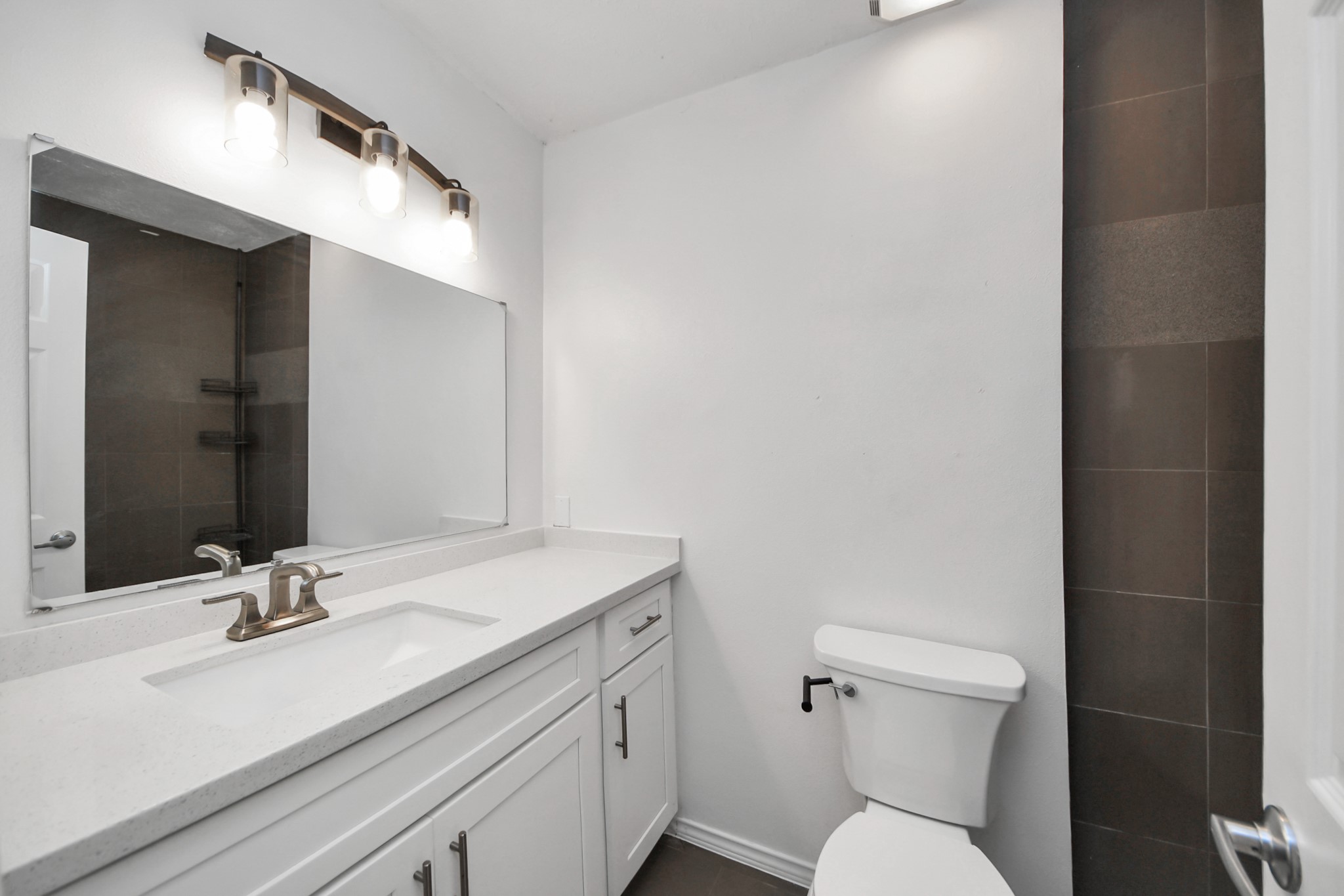 411 Dover Lane Spring, TX 77373 - Photo 34 of 40 a bathroom with a sink toilet and shower