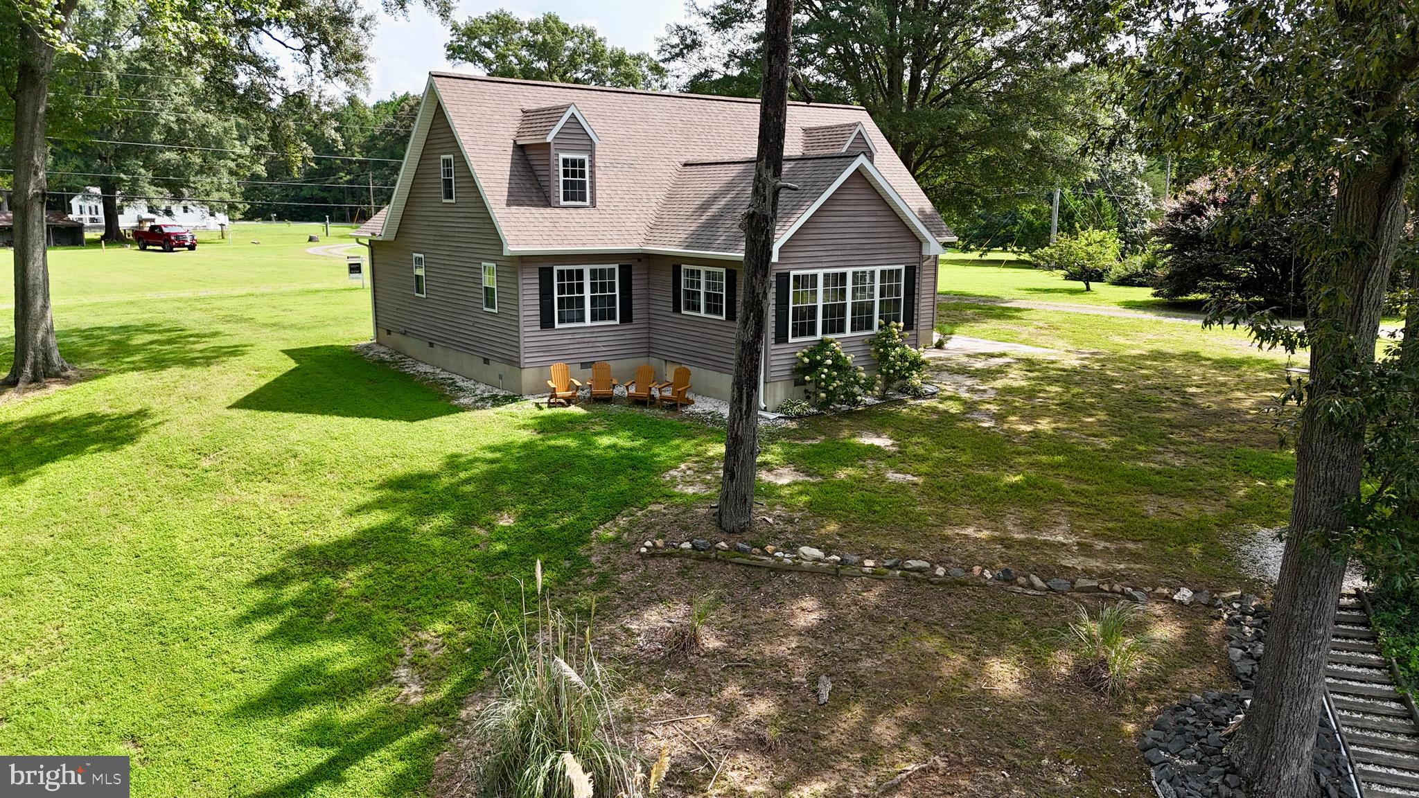 308 Apple Tree Road Montross, VA 22520 - Photo 4 of 55 a front view of a house with yard and green space