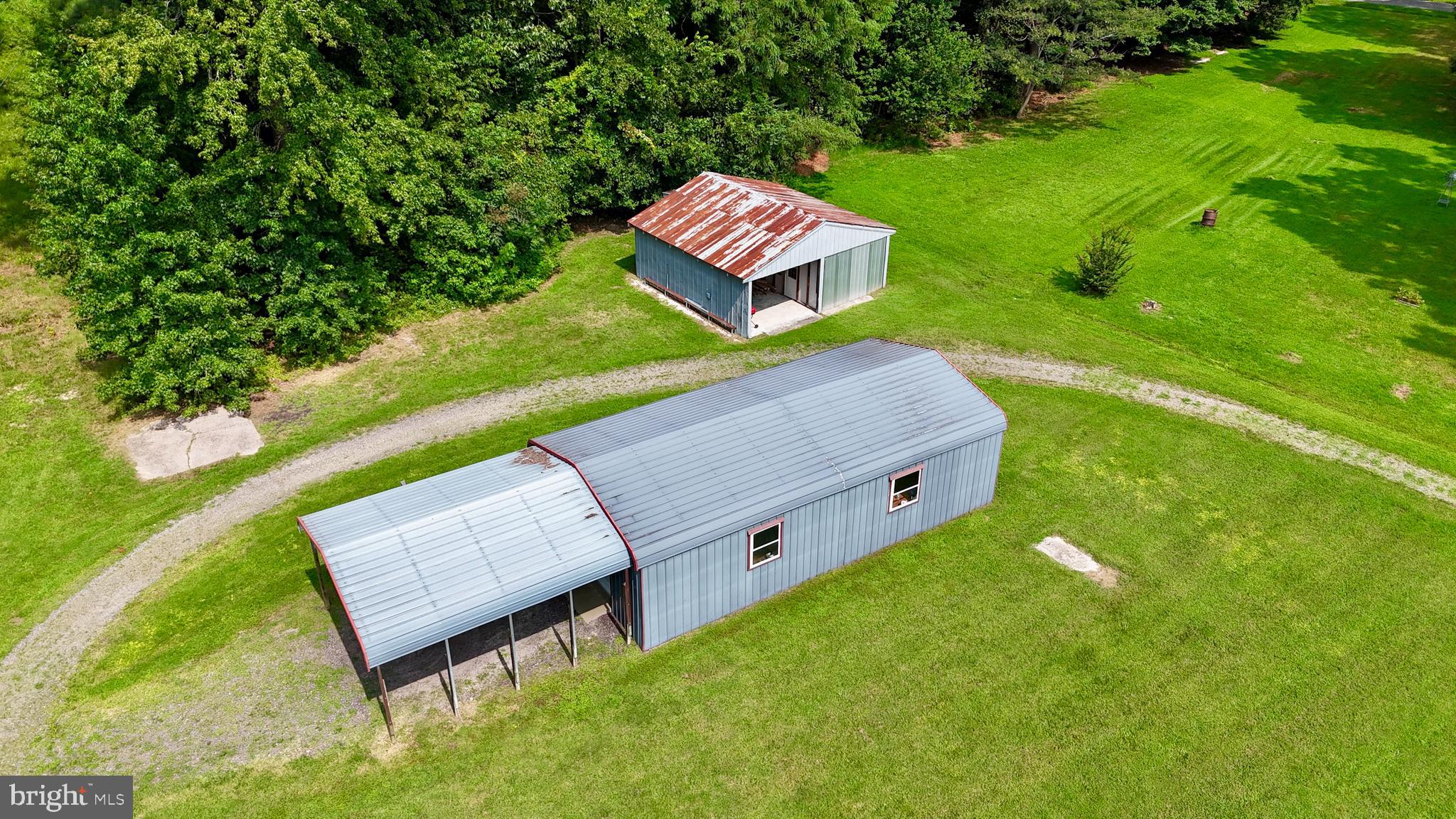 308 Apple Tree Road Montross, VA 22520 - Photo 47 of 55 a view of a back yard of the house and a garden