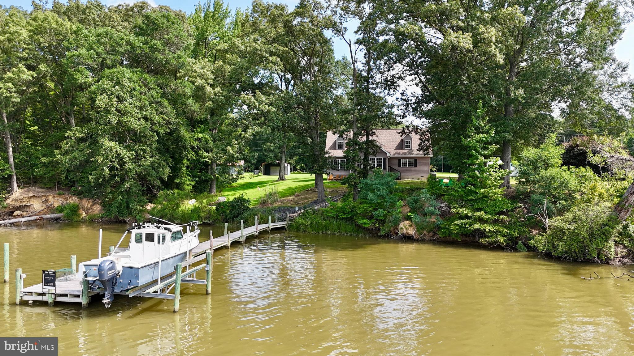 308 Apple Tree Road Montross, VA 22520 - Photo 49 of 55 a small pool with trees in the background