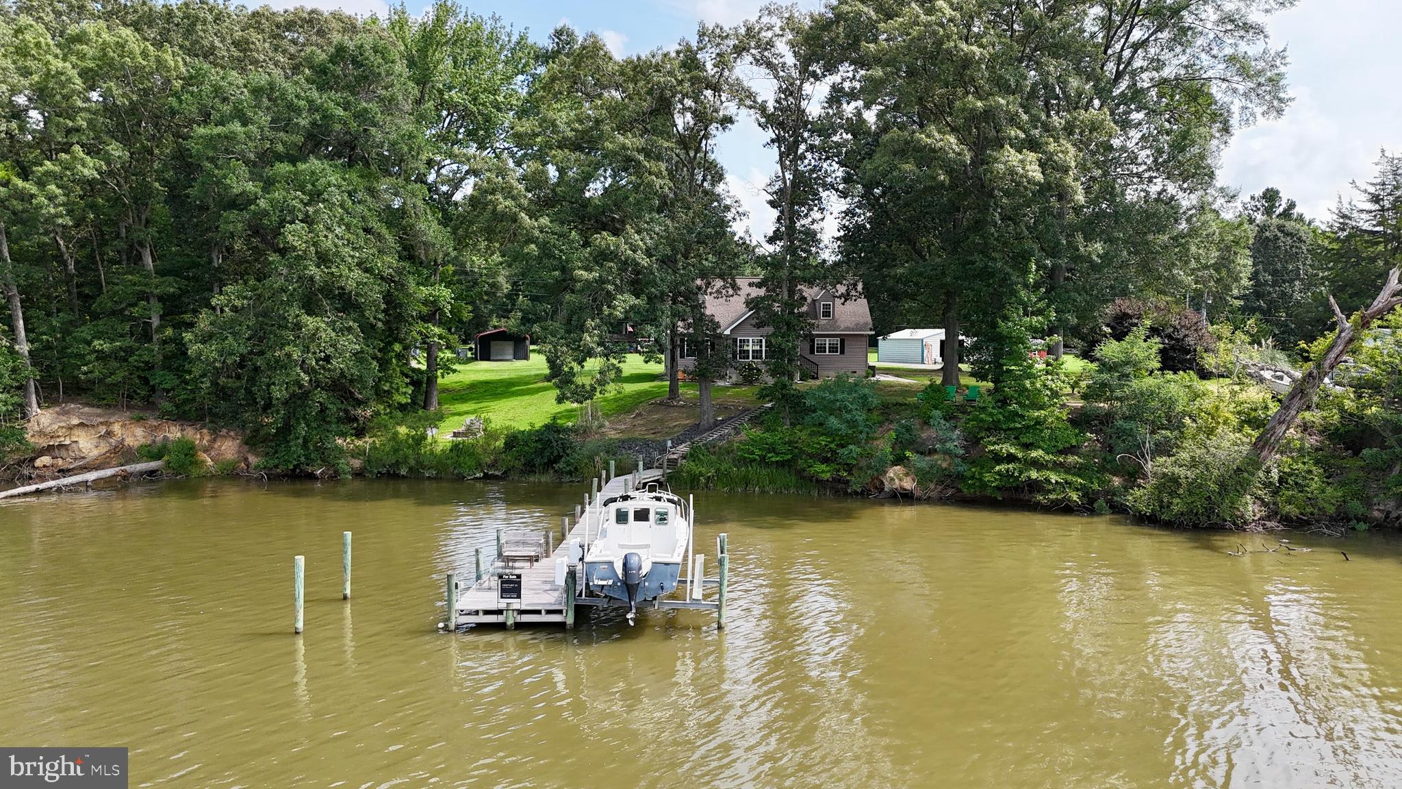 308 Apple Tree Road Montross, VA 22520 - Photo 51 of 55 a view of a lake with a house