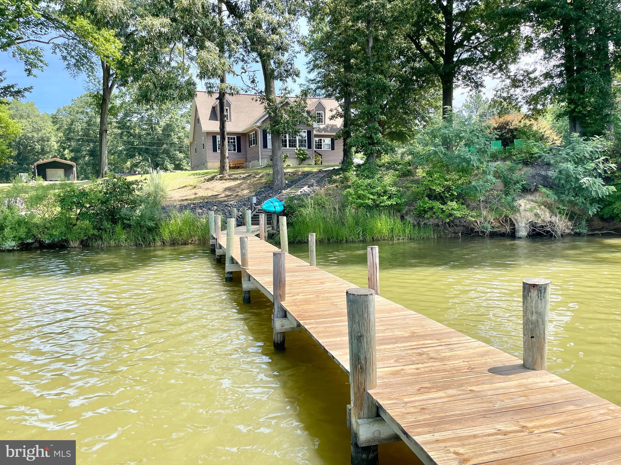 308 Apple Tree Road Montross, VA 22520 - Photo 10 of 55 a view of a lake with a large trees