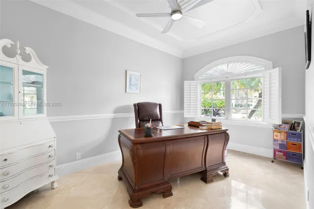 a bedroom with a bed couch and window