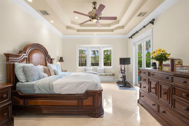 a spacious bathroom with a sink a large mirror a bathtub and next to a window