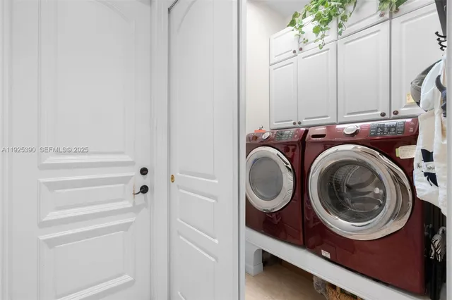 a living room with furniture and a book shelf