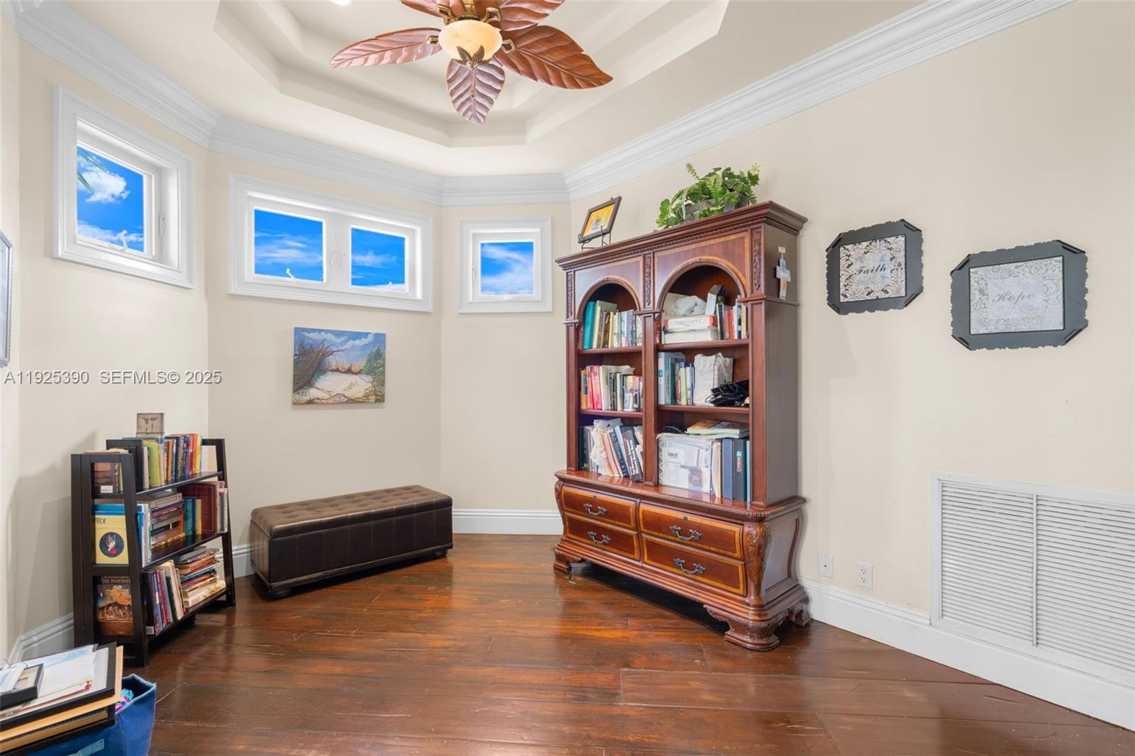 3406 Leigh Road Pompano Beach, FL 33062 - Photo 24 of 49 a living room with furniture and a book shelf