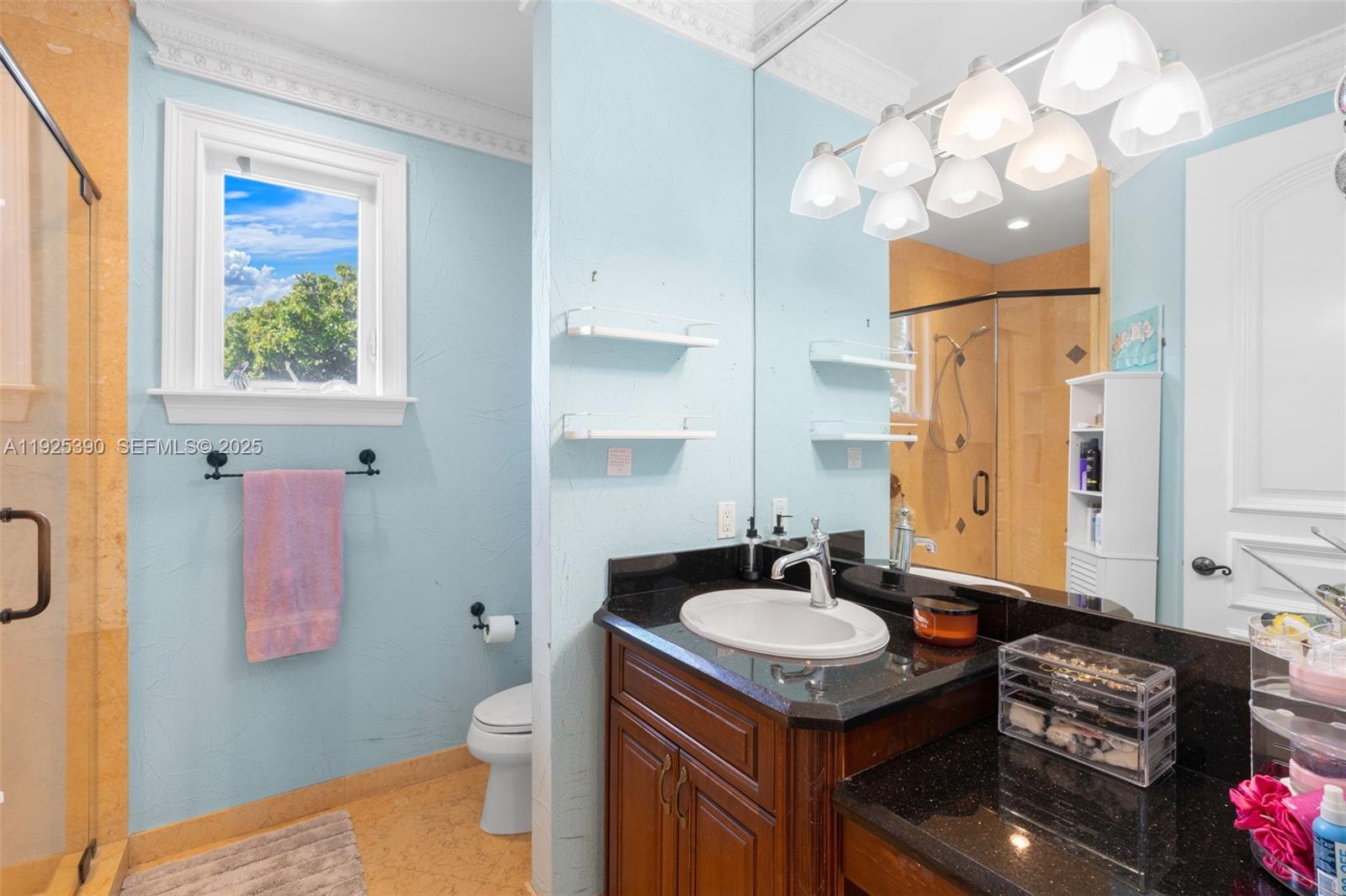 3406 Leigh Road Pompano Beach, FL 33062 - Photo 26 of 49 a bathroom with a granite countertop sink a toilet and a mirror