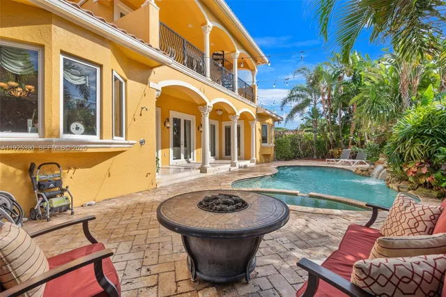 an aerial view of houses with yard
