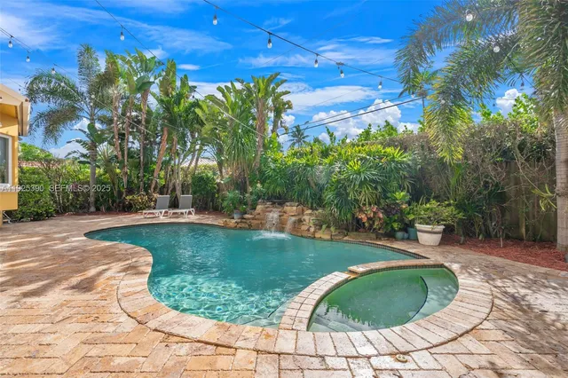 a view of a garden with a patio