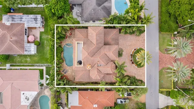 a view of a backyard with potted plants