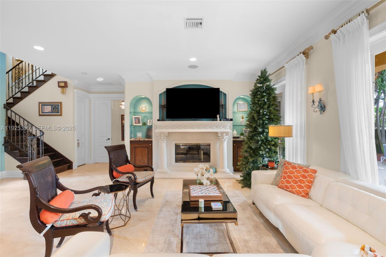 3406 Leigh Road Pompano Beach, FL 33062 - Photo 9 of 49 a living room with furniture a fireplace and a flat screen tv