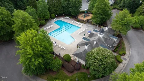 an aerial view of a house with a swimming pool