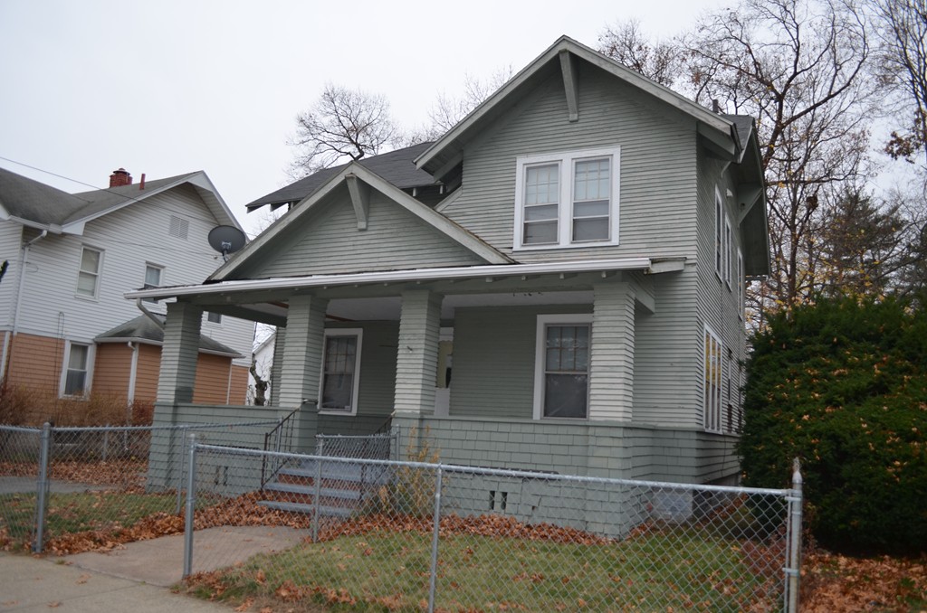 a front view of a house with garage