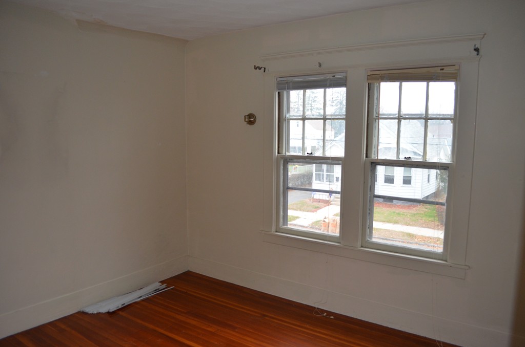 32 Ardmore Street Springfield, MA 01104 - Photo 15 of 17 an empty room with wooden floor and windows