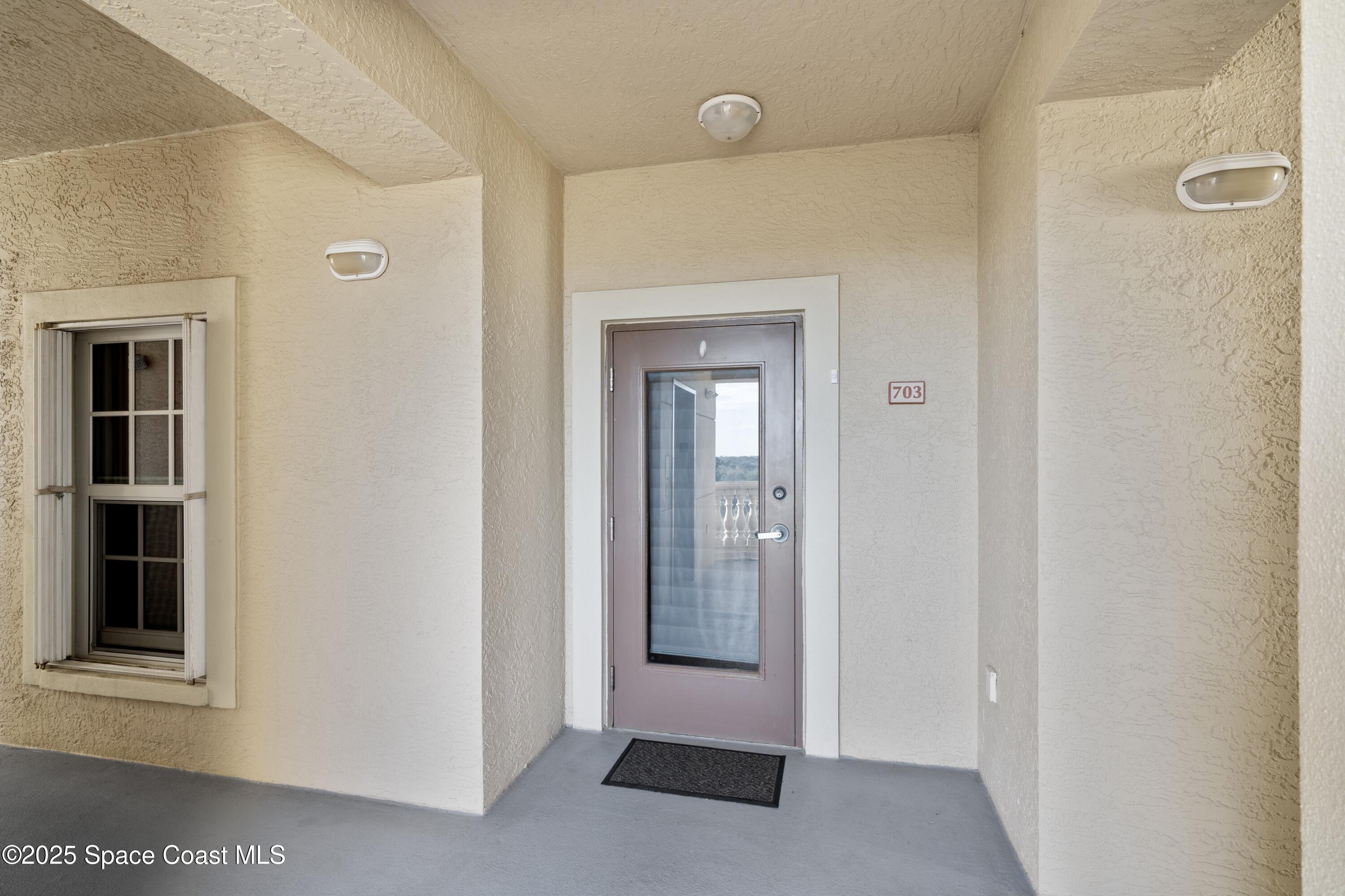 4975 Dixie Highway Northeast, Unit 703 Palm Bay, FL 32905 - Photo 27 of 28 Front door