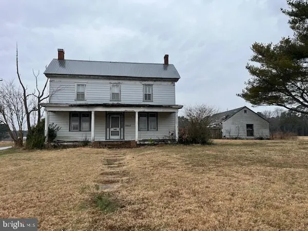 a front view of a house with yard