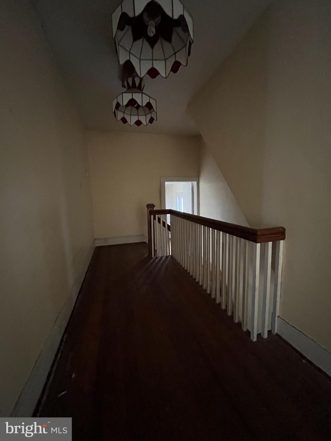 10603 Bishopville Road Bishopville, MD 21813 - Photo 14 of 28 a view of a hallway with a flower pot on the table