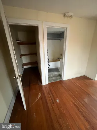 a view of an empty room and a cabinet