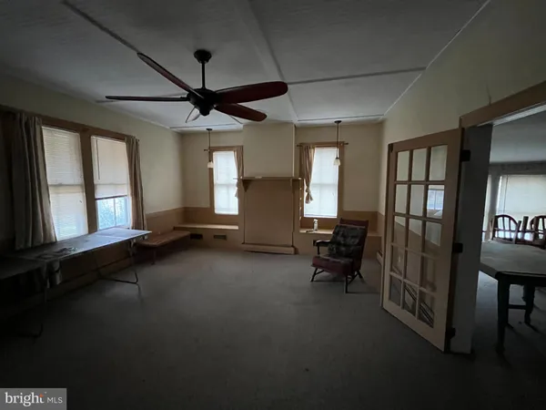a view of a livingroom with furniture and windows