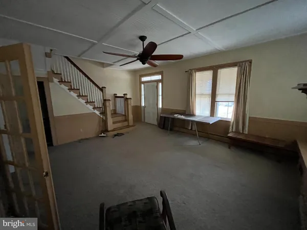 a view of an empty room with a window