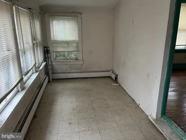 a view of an empty room and a window