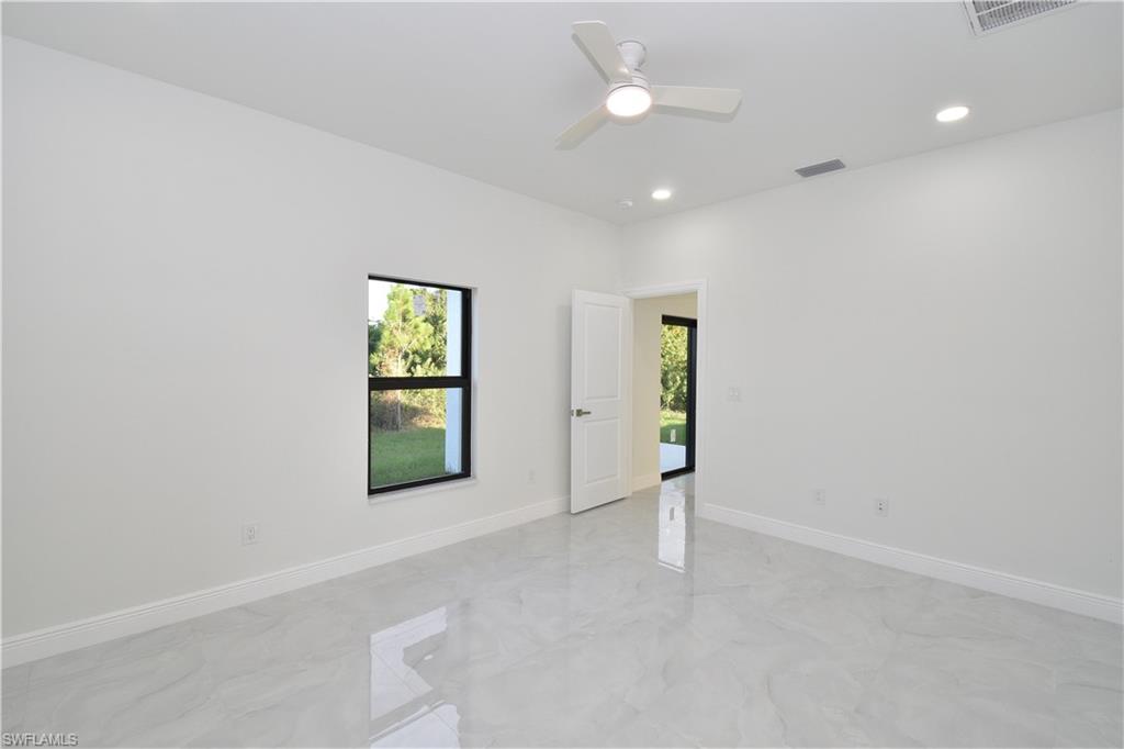 349 Naples Avenue South Lehigh Acres, FL 33974 - Photo 12 of 22 an empty room with windows and closet