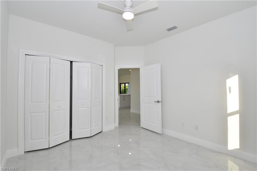 349 Naples Avenue South Lehigh Acres, FL 33974 - Photo 19 of 22 an empty room with closet area