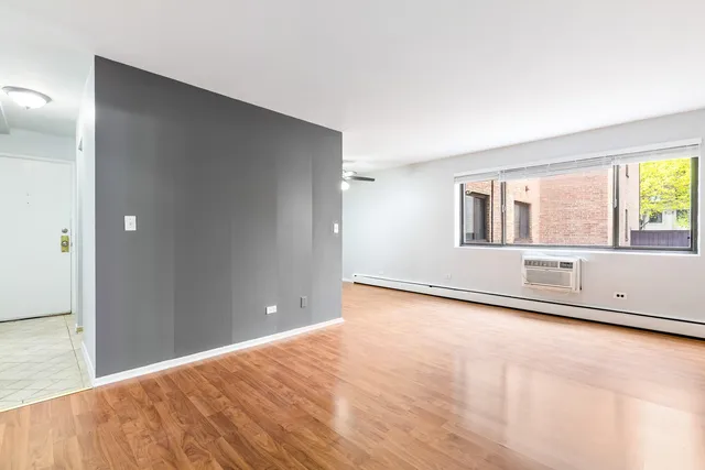 a view of an empty room with a window